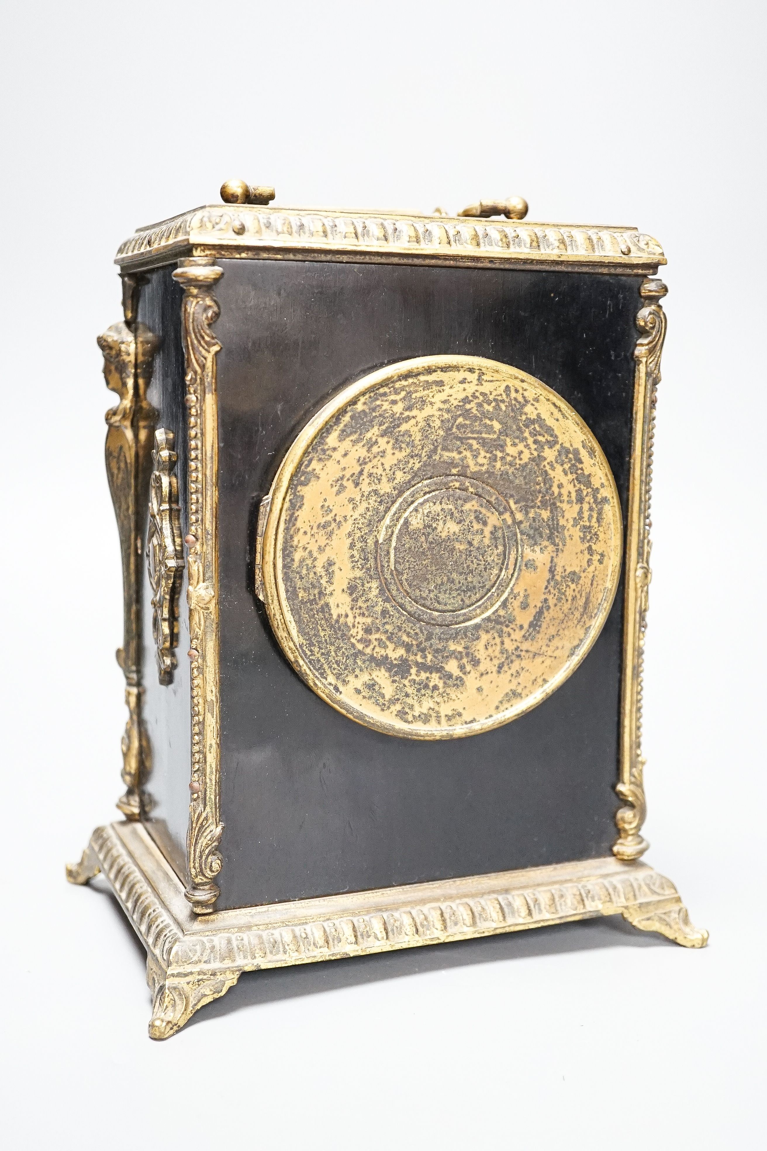 A 19th century French ebonised and ormolu-mounted mantel clock with key, 27cm including handle